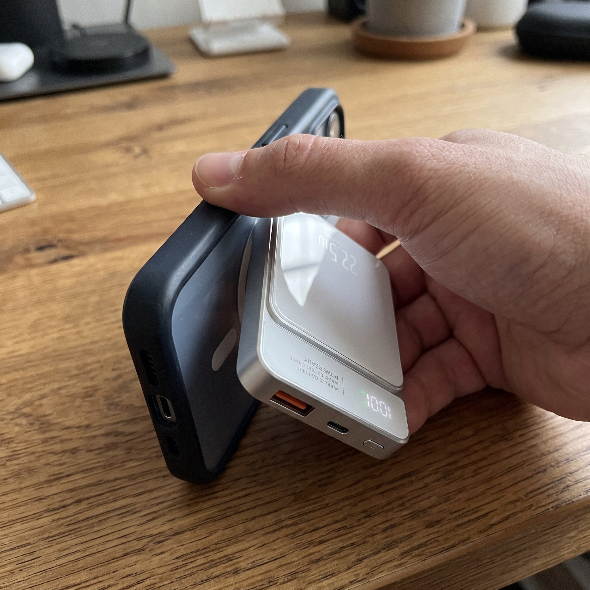 White CarryCharge attaching to a phone at a desk