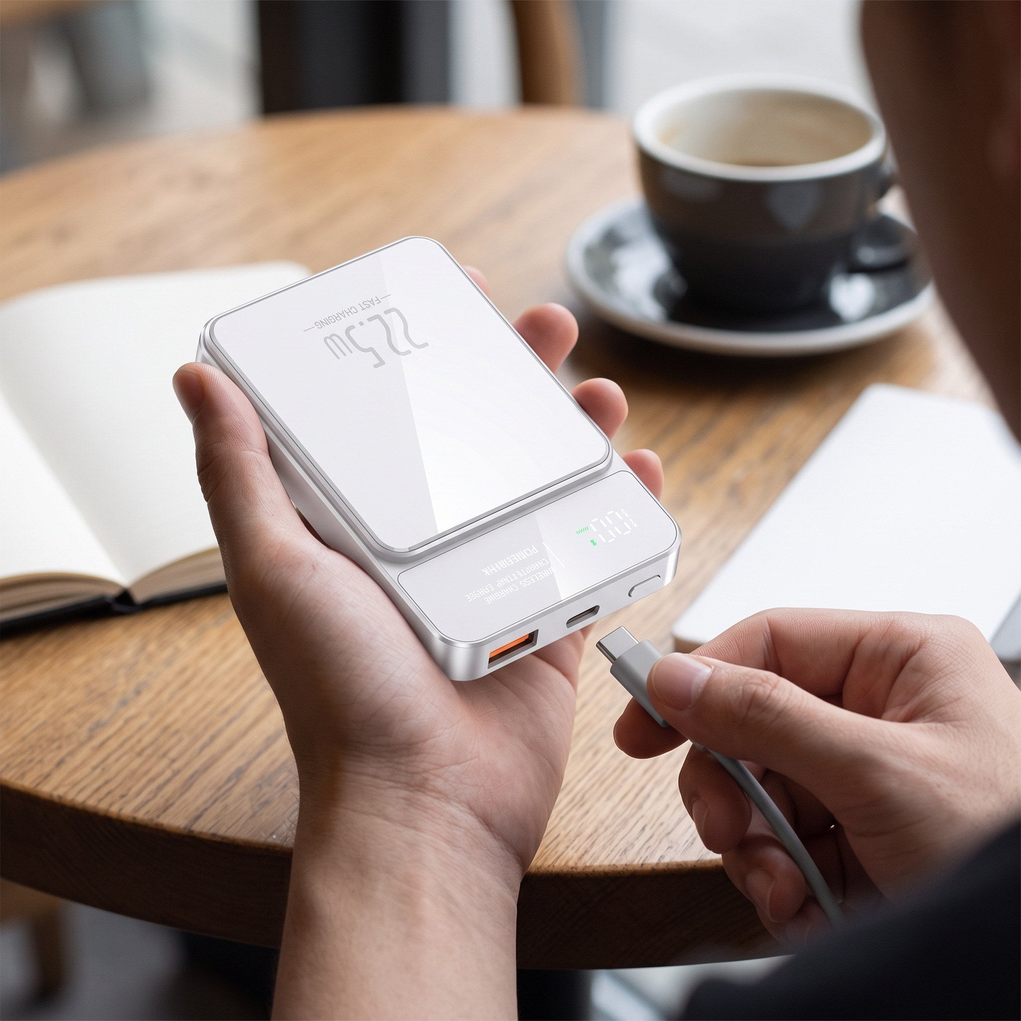 White CarryCharge port detail in hand
